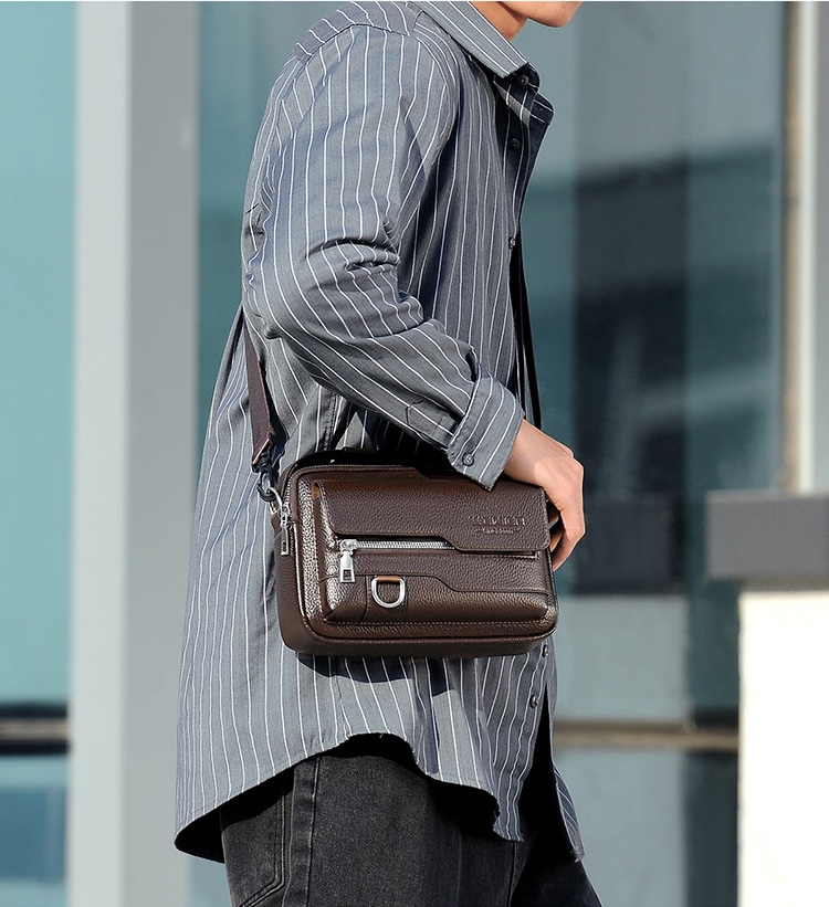 Male model wearing a brown compact crossbody bag