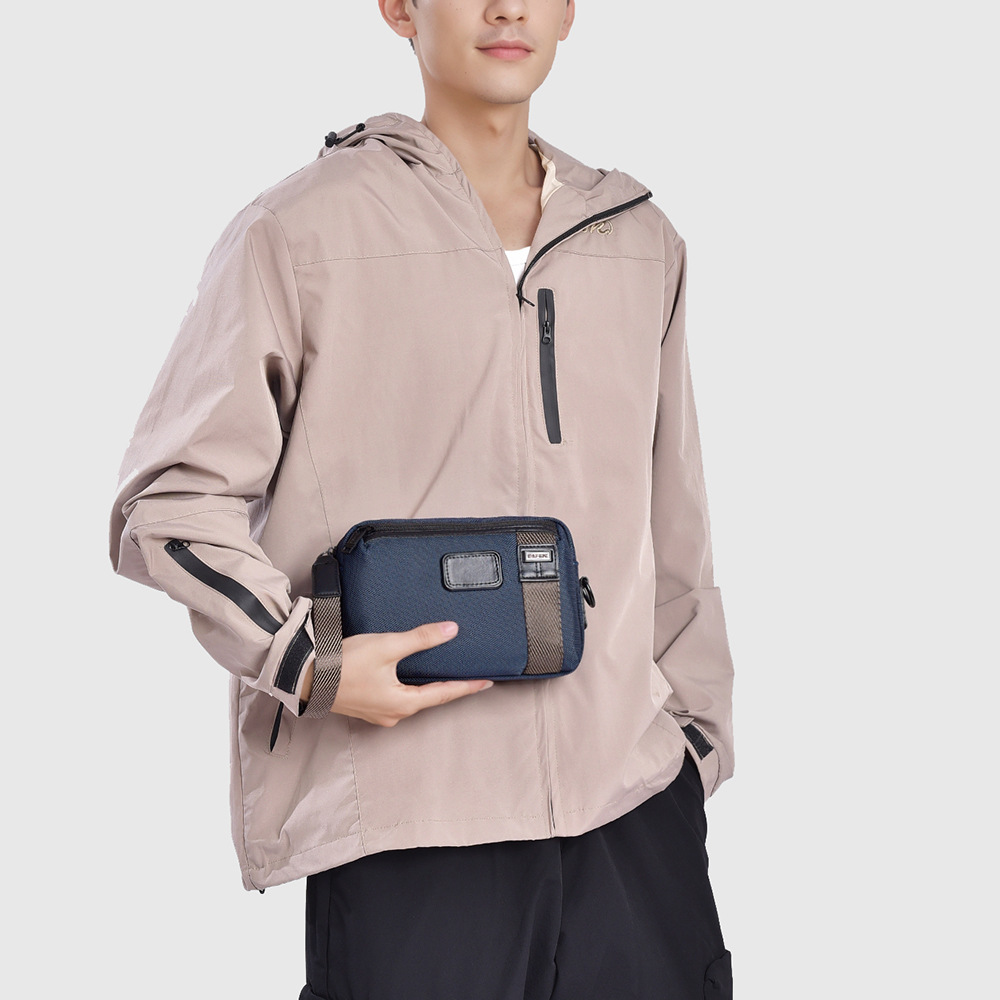 Male model carrying a compact BegVogue-style crossbody bag